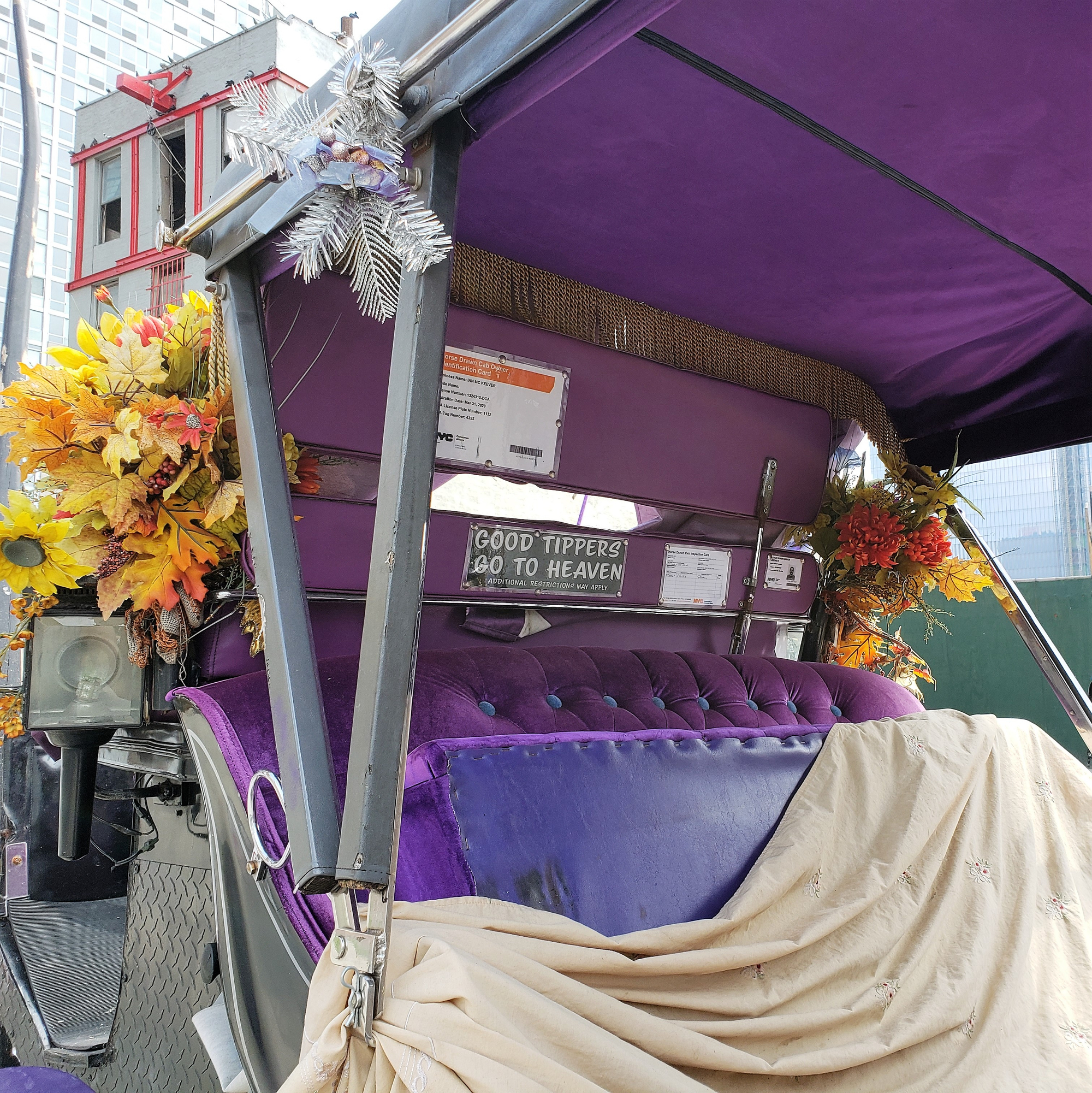 Horse carriage with a sign reading 'Good tippers go to heaven'